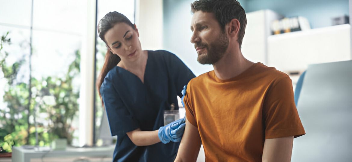 Doctor providing travel health advice to patient