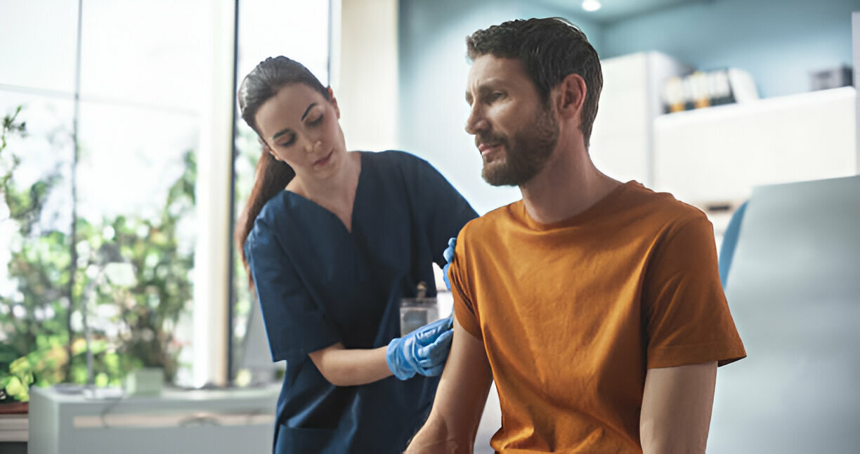 Doctor providing travel health advice to patient